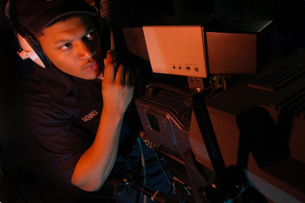 South China Sea (Nov. 28, 2006) - Mass Communication Specialist Seaman Benjamin Dennis, 23, from Queens, N.Y., adjusts the focus on a video camera for an upcoming safety training production in the television studio aboard USS Kitty Hawk (CV 63). Kitty Hawk's media division ensures Sailors are kept up to date by recording and airing news reports, documenting operations with still photography, providing photographic investigation support, and printing documents and manuals for the command. Kitty Hawk, operating out of Fleet Activities Yokosuka, Japan, is currently deployed in the South China Sea on a regularly scheduled fall deployment. U.S. Navy photo by Mass Communication Specialist Seaman Thomas J. Holt (RELEASED)