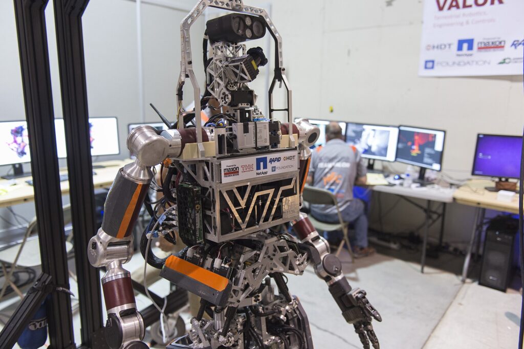 Scientists in a modern lab using AI-powered tools and data dashboards