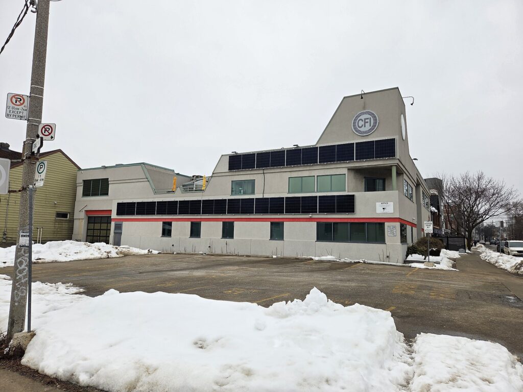 Wall-mounted solar panels on commercial building in Toronto, Ontario, Canada